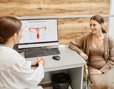 SMWC - woman smiling during consultation with ob gyn