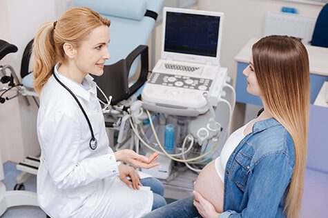 SMWC - obstetrician enjoying conversation with pregnant patient